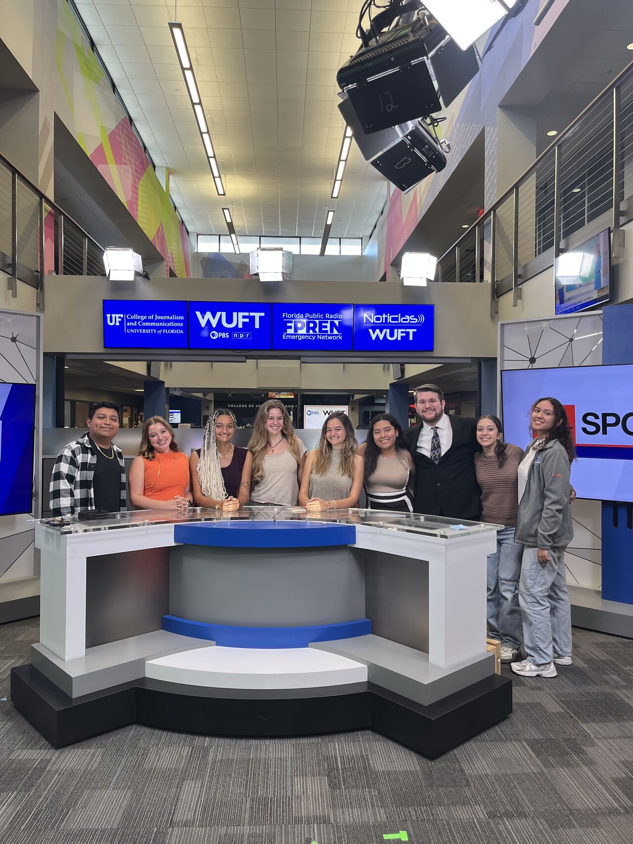 Carston with fellow reporters in the WUFT newsroom